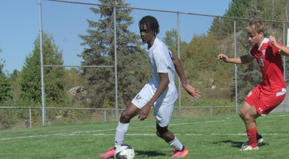 Joshua Geddes dribbling past defender - Mark Wilson