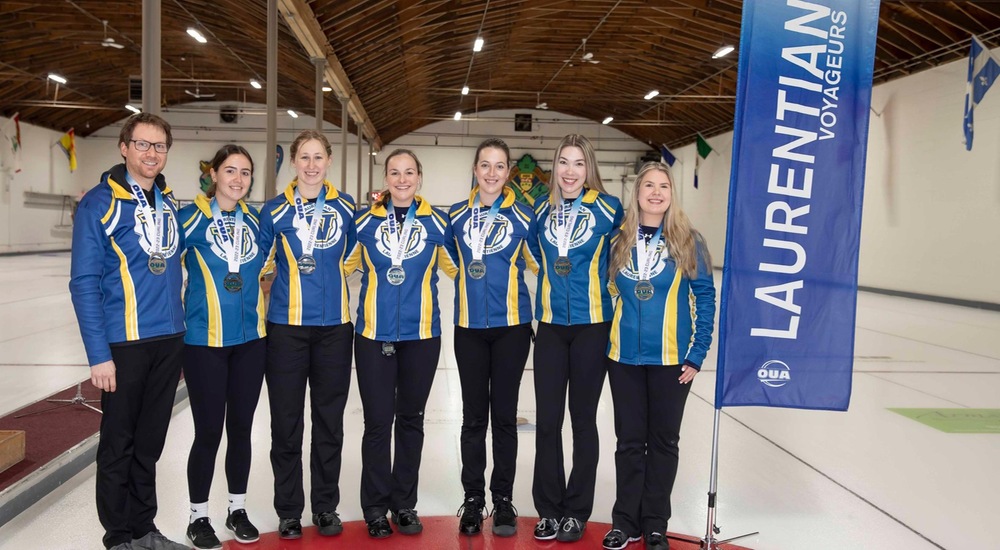 The women's curling team with their OUA silver medals - Allen Fournier